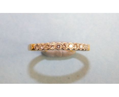 A half-eternity ring collet-set eleven brilliant-cut diamonds, in 18ct white and yellow gold mount, size O, 2.8g.