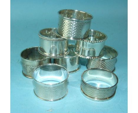 A pair of engine-turned napkin rings, Birmingham 1921 and six others.