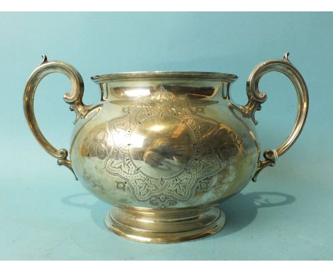 A Victorian circular two-handled sugar basin of engraved compressed form, 21cm diameter, 11cm high, London 1872, ___10oz.