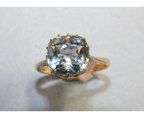 A modern gold ring claw-set an aquamarine of approximately 4.5cts, size M½, 3.5g.