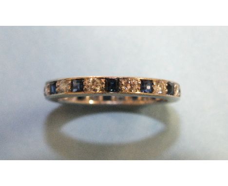 A sapphire and diamond eternity ring alternately-set thirteen each brilliant-cut diamonds and square-cut sapphires, in unmark