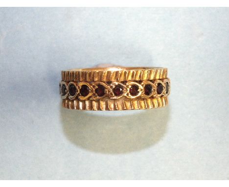 A 9ct gold eternity-style ring set garnets, size P, 4.6g.