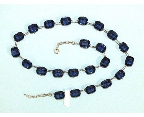 A rivière of sapphire-blue paste stones claw-set in white metal mounts, impressed Pat. App. For, 41.5cm long, (no ring bolt).