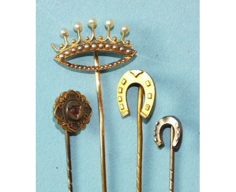 A gold stick pin in the form of a coronet set pearls, (damaged), a small 15ct gold horseshoe stick pin and two others, (4).