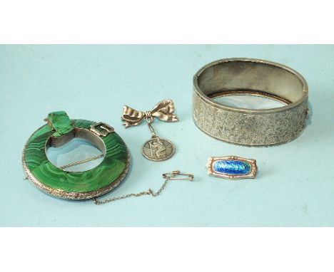 A Victorian white-metal-mounted malachite buckle brooch, 6cm diameter, a white metal hinged bangle, a bow brooch and a small 