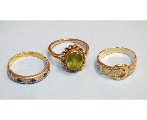 A 9ct gold ring set peridot, size M, 2.8g (very worn), a synthetic blue and white stone set ring with 22ct gold shank, size M