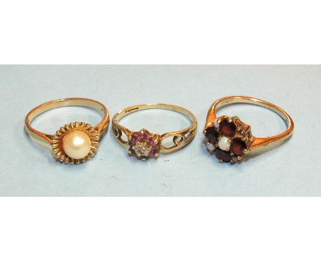 A 9ct gold opal and garnet cluster ring, another set cultured pearl, both size N and a small cluster ring, size L, 6g, (3).