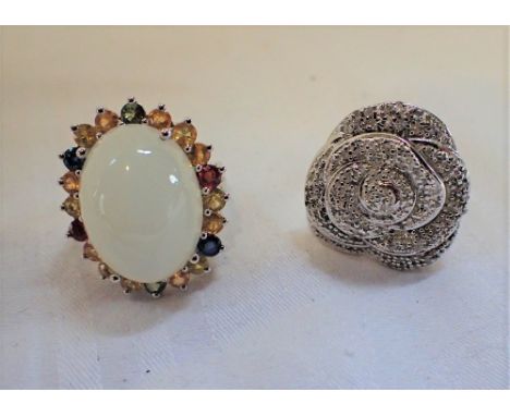 A DIAMOND SET RING IN THE FORM OF A FLOWER, together with one other gem set ring, one ring size O the other ring size K