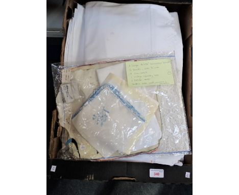 A COLLECTION OF LINEN, a large Seersucker tablecloth, 2 sheets, 19 pillowcases, a Vintage laundry bag, a bolster case and a c