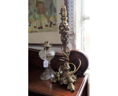 A ROCOCO BRASS TABLE LAMP and a pressed glass oil lamp