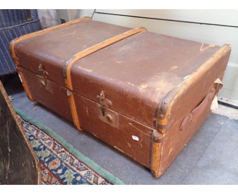 A VINTAGE WOODEN BOUND CABIN TRUNK, with contents to include a Matchbox K44 transporter, two Vintage Blue Peter Jigsaws and s