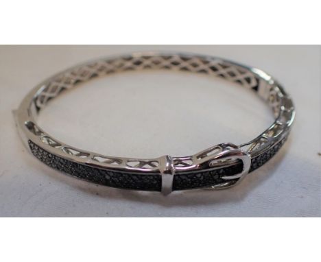 A BLACK GEM-STONE BUCKLE BANGLE, the clasp stamped '925'