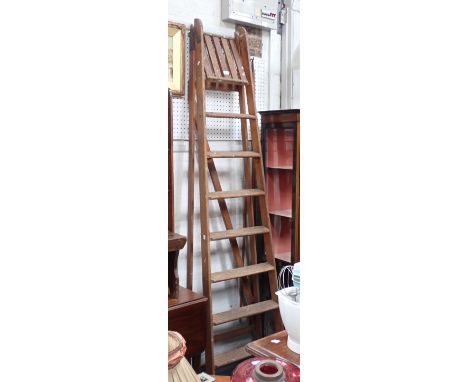 A VINTAGE WOODEN STEP LADDER