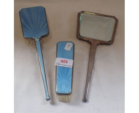 THREE-PIECE SILVER AND ENAMEL BACKED ART DECO DRESSING TABLE SET