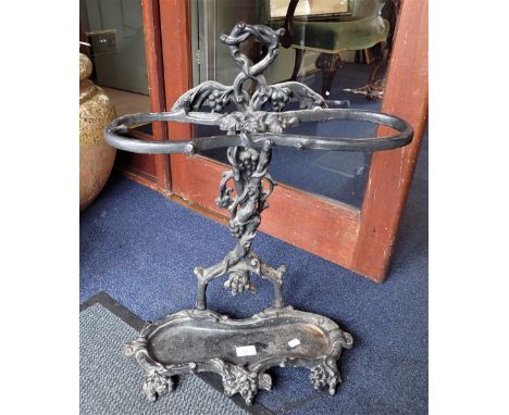 A CAST IRON STICK STAND with grape vine decoration 