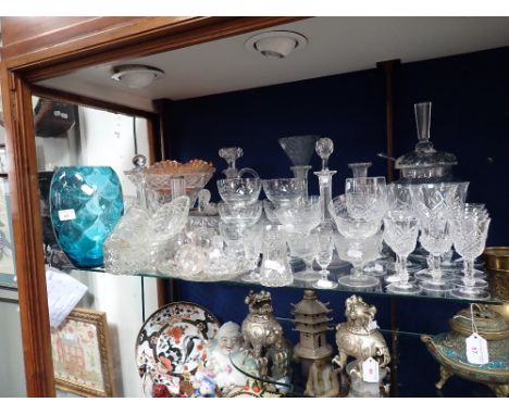 A GLASS FOOTED COVERED JAR with ladle and a collection of glassware