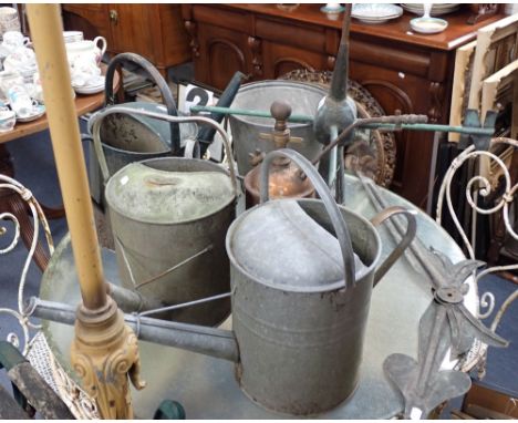 A PAIR OF METAL TURRET CLOCK HANDS, a copper weather vane base (no vane) Vintage watering cans and sundries