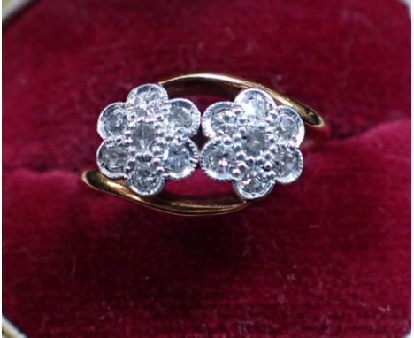 A DIAMOND FLORAL CROSSOVER RING, on a 18ct gold shank, ring size H-I