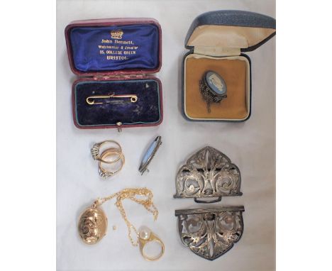 A 9CT GOLD EGG LOCKET ON CHAIN, a silver Nurse's Buckle, Pearl and 18ct gold ring, a ruby and pearl Gypsy ring and other jewe
