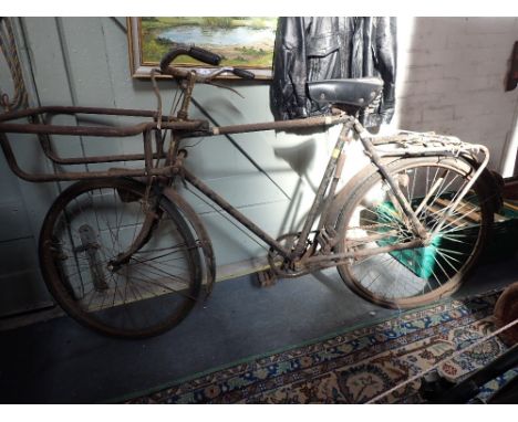 A VINTAGE 'TRADE' BICYCLE with iron delivery box holder to the front