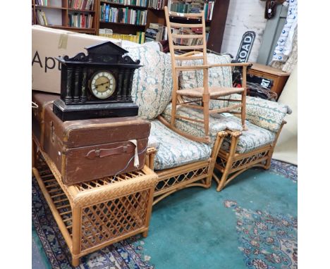 A PALE BEECH SHAKER STYLE LADDER BACK ROCKING CHAIR with rush seat, and a pair of conservatory armchairs and coffee table