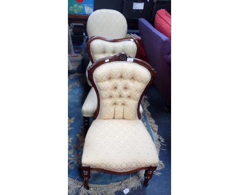 A VICTORIAN BUTTON BACK OCCASIONAL CHAIR and two others, similar