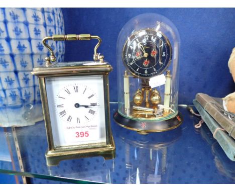 A BRASS CASED CARRIAGE CLOCK and a small anniversary clock (2) 