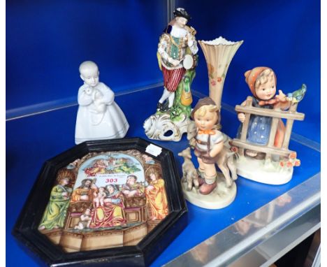 A CONTINENTAL CERAMIC PLAQUE, depicting a religious scene, a Hummell figure and similar ceramics 