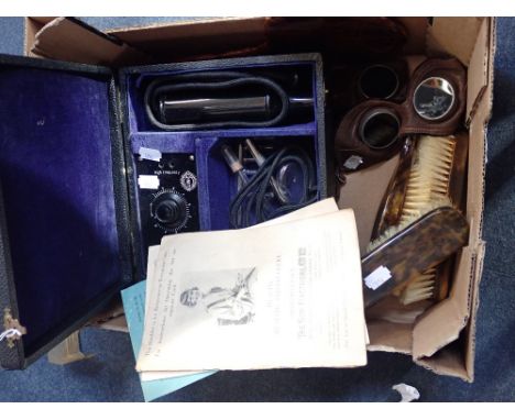 A VINTAGE 'SUNCO' HEALING MACHINE, with two pairs of leather goggles and a part brush set