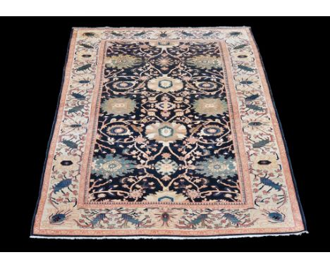  A woven carpet  , in Zeigler Mahal style, 20th century, with perfuse floral decoration, approximately 550cm x 318cm  Provena