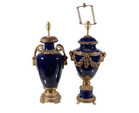  Two similar blue ceramic and gilt metal mounted table lamps  , late 20th century, each with flanking rams heads, each 48cm h