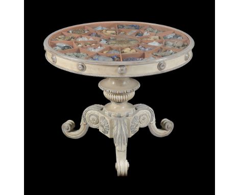  A painted centre table , of recent manufacture, the glass top enclosing a collections of fossils and mineral specimens inclu