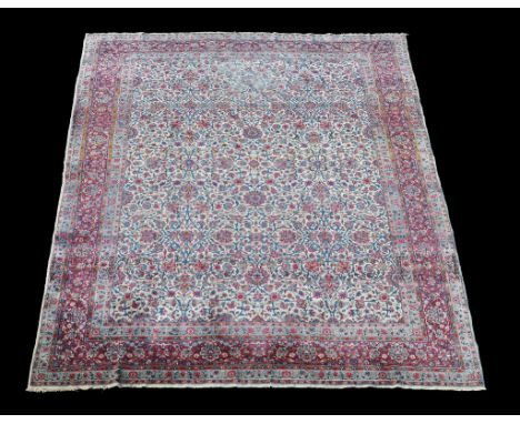  A Tabriz carpet  , of overall design, approximately, 330cm x 415cm 