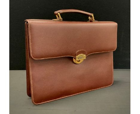 Burberry brown leather briefcase, interlined Burberry material, fitted interior with pockets and compartments, spring lock, 2