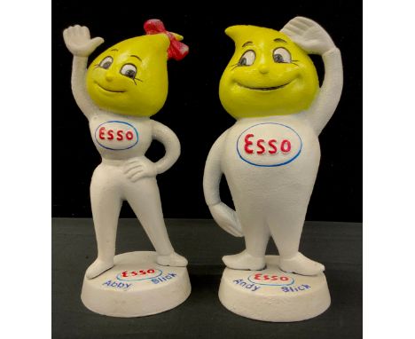 A pair of reproduction cast iron Esso money banks, 24cm high (2) 