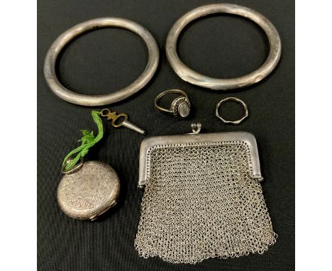 A near pair of silver coloured metal slave bangles, stamped w &amp; Co W, Silver,  Raquet 925 silver chain mesh coin purse, i