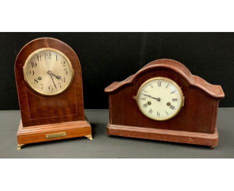 An early 20th century inlaid mahogany dome top clock, silvered dial, bold Arabic numerals, eight day movement,  33cm high;  a