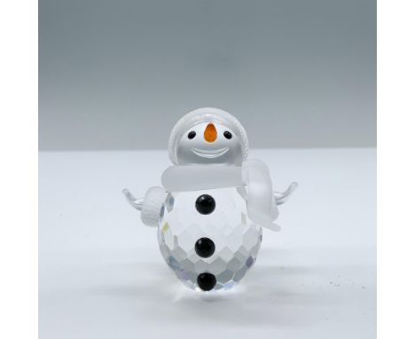 A clear crystal snowman with frosted scarf, hat and mittens. The face is frosted with black eyes and a orange crystal carrot 