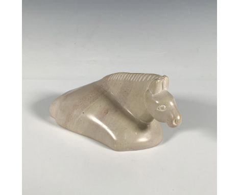 This exquisite handcrafted soapstone figurine, in a lovely beige hue with subtle light pink accents, depicts a horse lying do