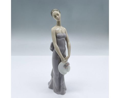 Features a figure of a delicate woman dressed in lavender, holding a white sun hat. This item has its original box measuring 