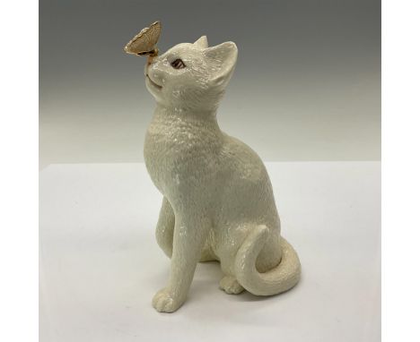 Adorable ivory china cat staring at a 24 karat gold butterfly that has landed on his nose. Created for the Ivory Cat Collecti