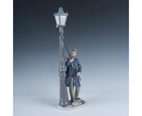 Glossy finish featuring a man lighting the street on a windy dark night. Lladro backstamp. Artist: Salvador FurioIssued: 1984