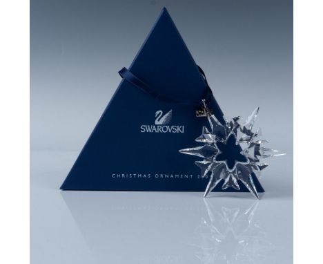 An exquisite clear crystal snowflake Christmas tree ornament with eight pointed tips. Swarovski backstamp. This item has its 