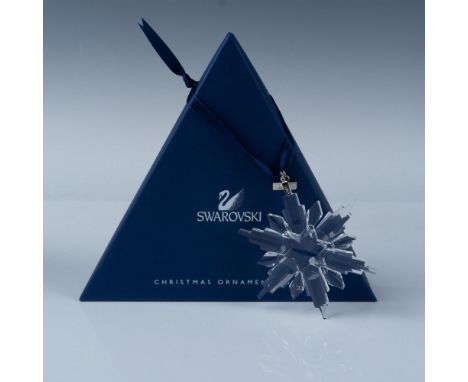 An exquisite clear crystal snowflake Christmas tree ornament with eight squared points. Swarovski backstamp. This item has it