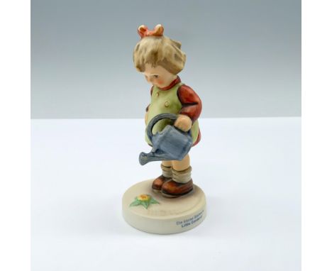 Hand painted girl with blue watering can. M.I. Hummel impressed. Goebel backstamp. 927/Hum 74. This item has its original box