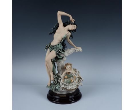 Handcrafted sculpture representing the zodiac sign Pisces. This elegant piece features a serene woman adorned in flowing drap