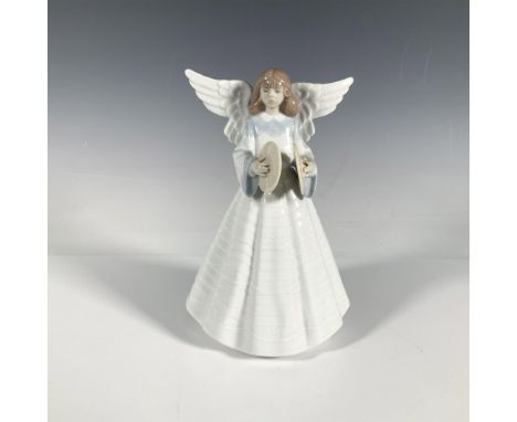 A glossy figure of an angelic girl in a lovely white dress, holding up cymbals. Lladro backstamp. Artist: Francisco CatalaIss