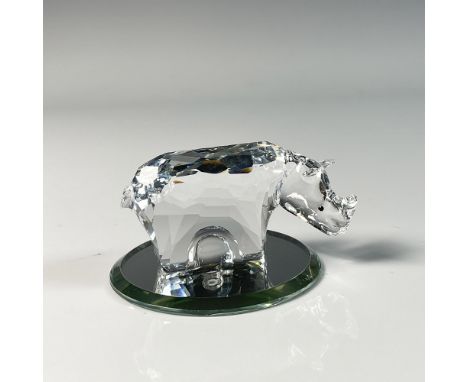 Stunning figure featuring rhinoceros with an intricate cut design crafted from clear crystal. This item has a round mirror ba