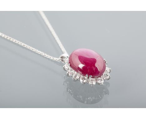 RUBY AND DIAMOND PENDANT
set with a large oval ruby of approximately 10.55 carats surrounded by diamonds totalling approximat