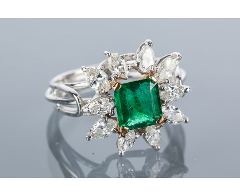 EMERALD AND DIAMOND CLUSTER RING
the central square step cut emerald 6.5mm across, surrounded by marquise cut diamonds, unmar